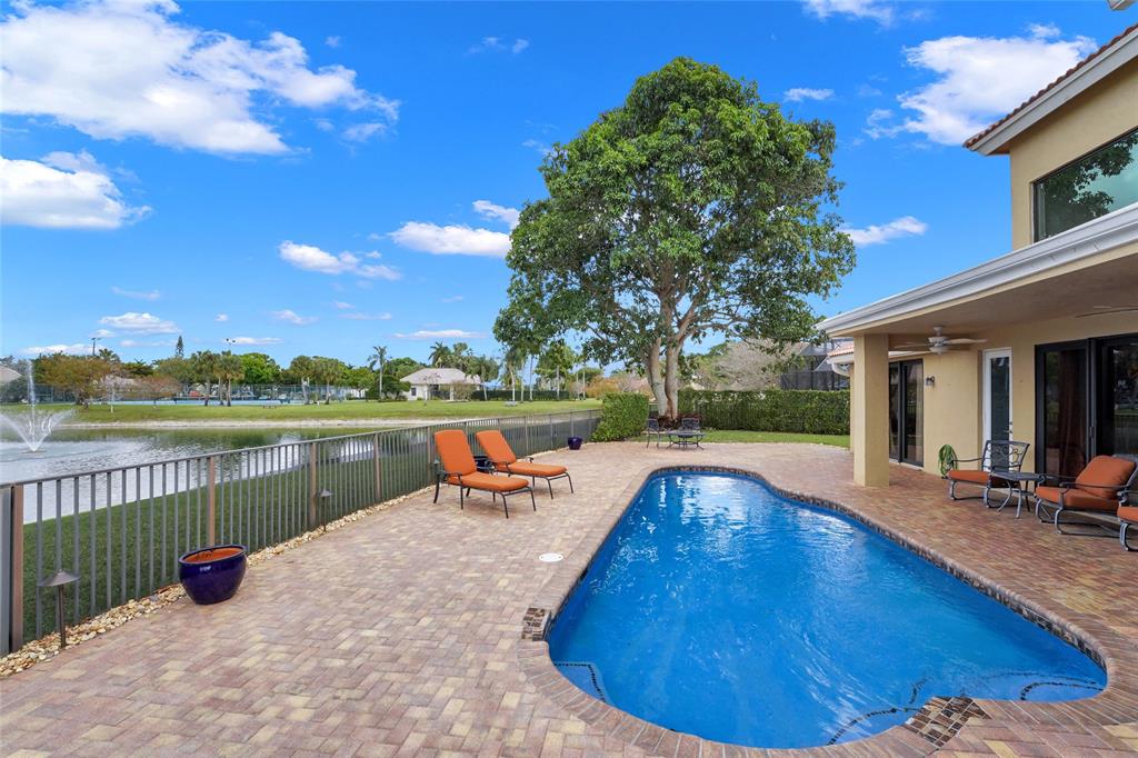 22280 Tupelo Place Boca Raton, FL 33428 - Photo 14 of 53 a view of swimming pool with lake view and mountain view