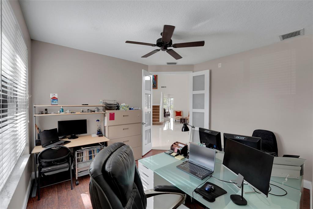 22280 Tupelo Place Boca Raton, FL 33428 - Photo 18 of 53 a room with furniture and a window