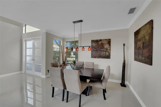 a living room with furniture a flat screen tv and a large window