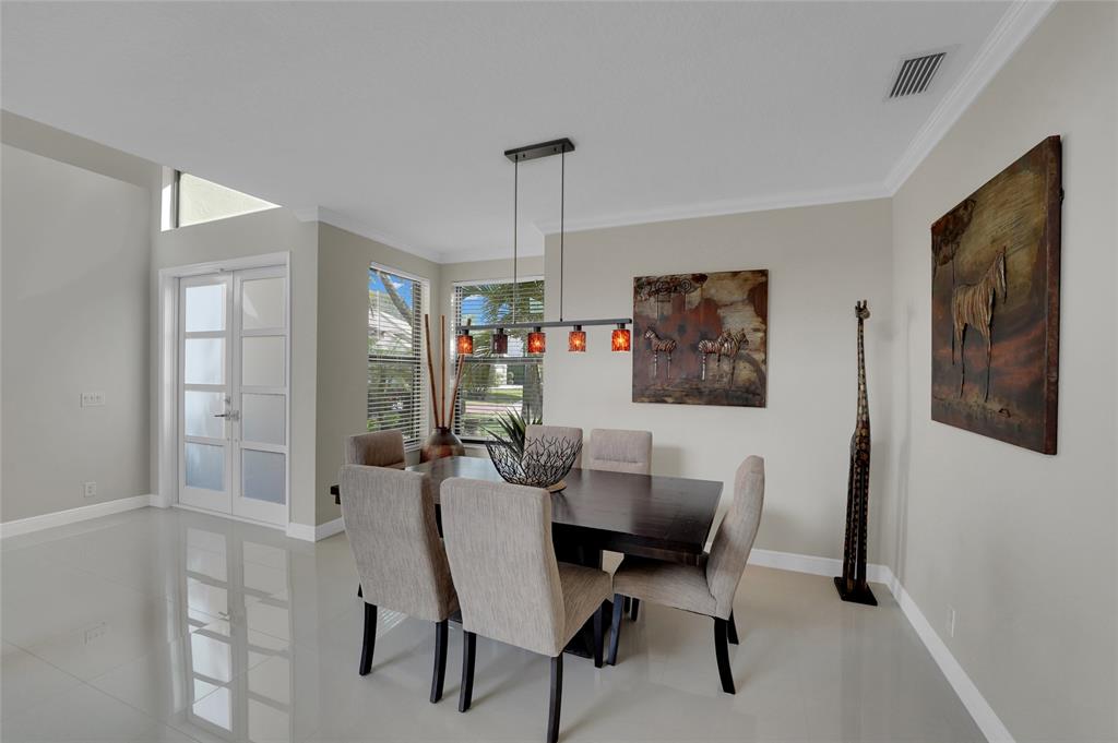22280 Tupelo Place Boca Raton, FL 33428 - Photo 19 of 53 a dining room with furniture and window