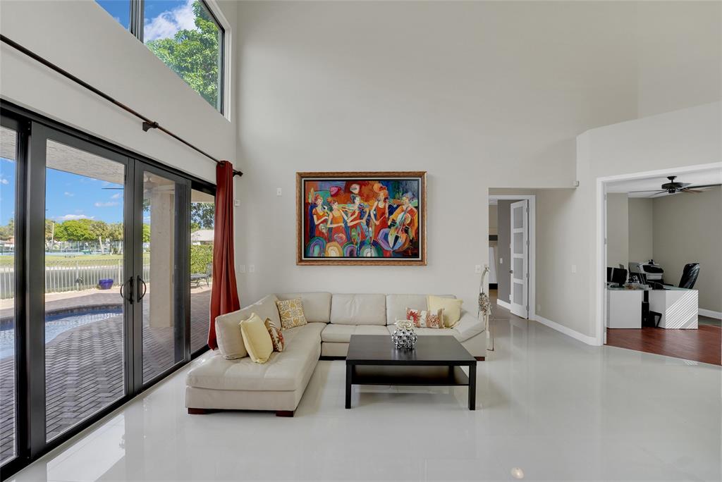 22280 Tupelo Place Boca Raton, FL 33428 - Photo 27 of 53 a bedroom with furniture and a large window