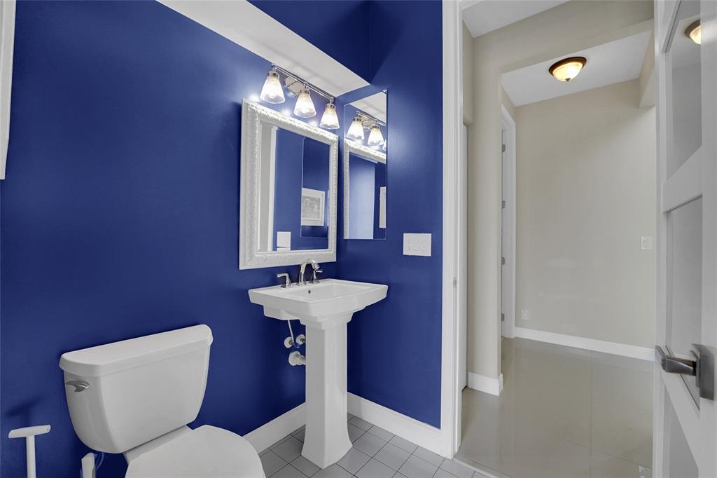 22280 Tupelo Place Boca Raton, FL 33428 - Photo 30 of 53 a bathroom with a toilet sink and mirror