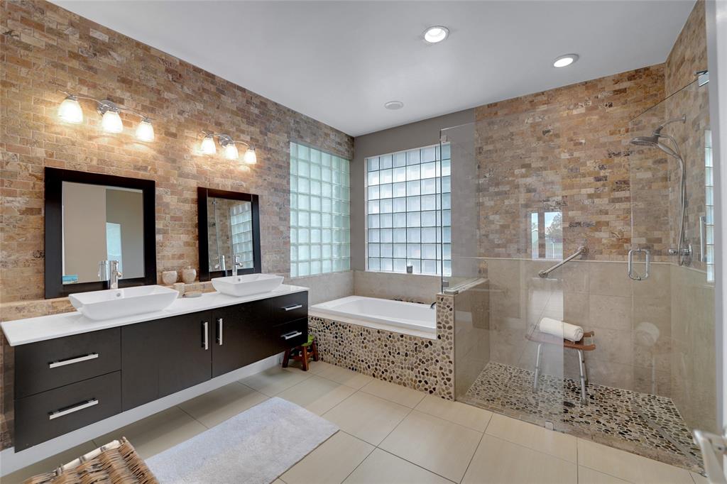 22280 Tupelo Place Boca Raton, FL 33428 - Photo 34 of 53 a large bathroom with a double vanity sink mirror and bathtub