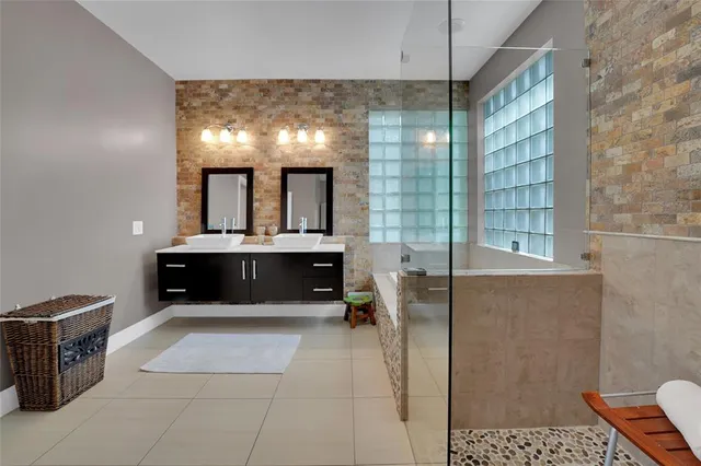 a bathroom with a sink and a window