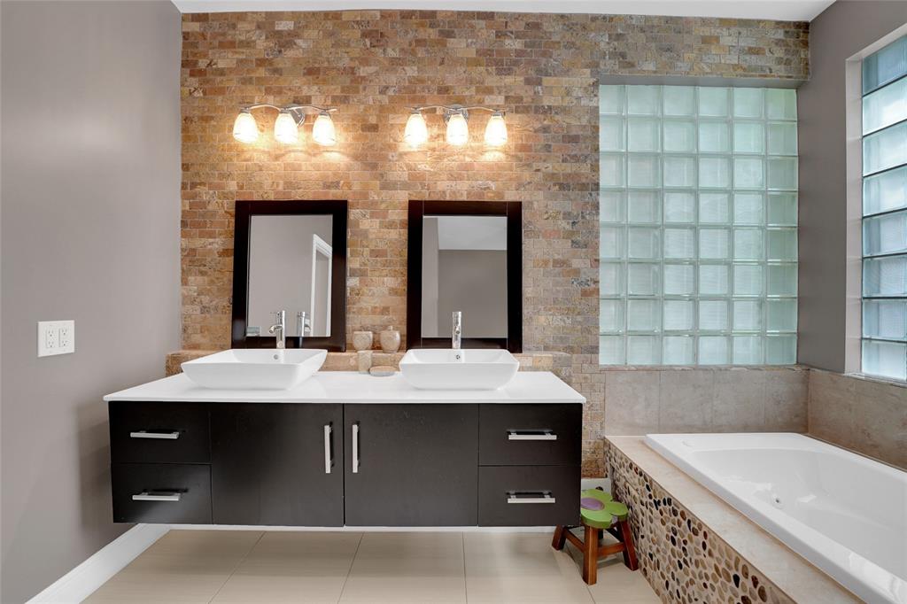 22280 Tupelo Place Boca Raton, FL 33428 - Photo 36 of 53 a room with a sink and a mirror