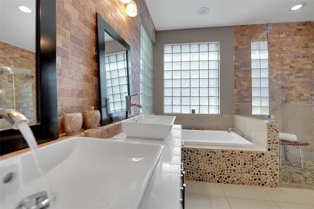 a bathroom with a bathtub and a sink