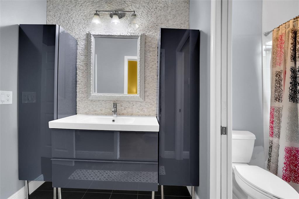 22280 Tupelo Place Boca Raton, FL 33428 - Photo 42 of 53 a bathroom with a sink toilet and mirror