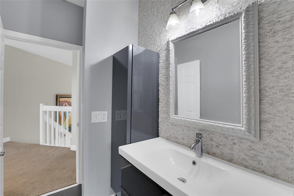 22280 Tupelo Place Boca Raton, FL 33428 - Photo 46 of 53 a bathroom with a sink and mirror