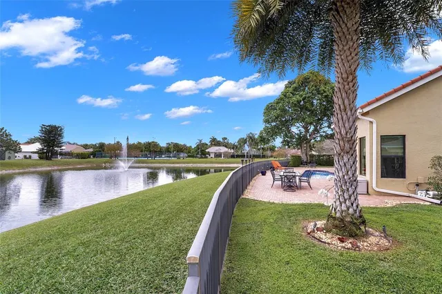 a view of a lake with a yard