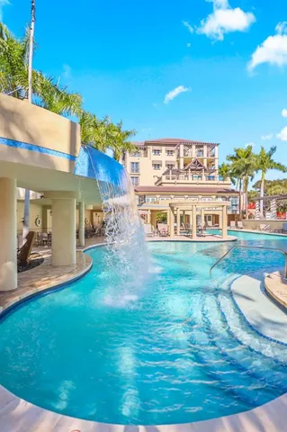 a view of a swimming pool with an outdoor seating