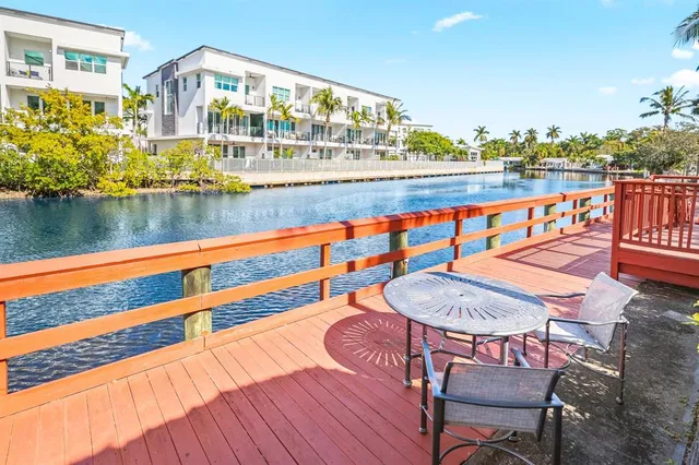 an aerial view of residential building and ocean view
