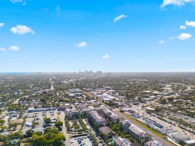 a brick building with trees in front of it