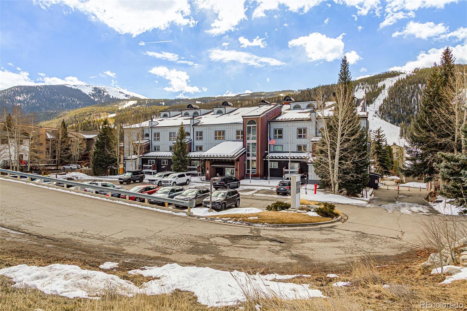 22864 Highway 6, Unit 107 Keystone, CO 80435 - Photo 1 of 20 a view of a lake with a houses