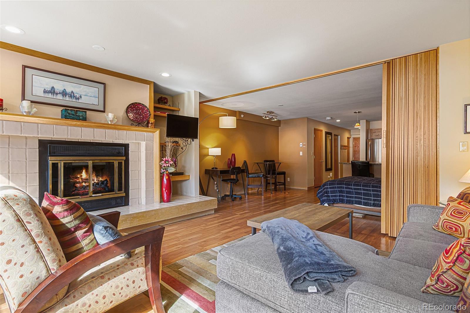 22864 Highway 6, Unit 107 Keystone, CO 80435 - Photo 11 of 20 a living room with furniture and a fireplace