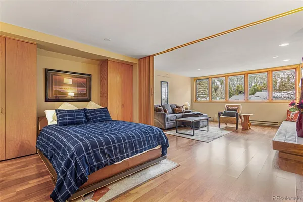 a bedroom with a bed and furniture