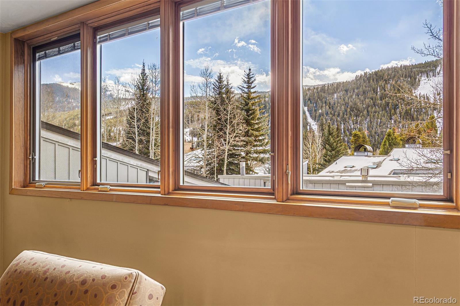 22864 Highway 6, Unit 107 Keystone, CO 80435 - Photo 6 of 20 a view of a room that has a bed and wooden floor