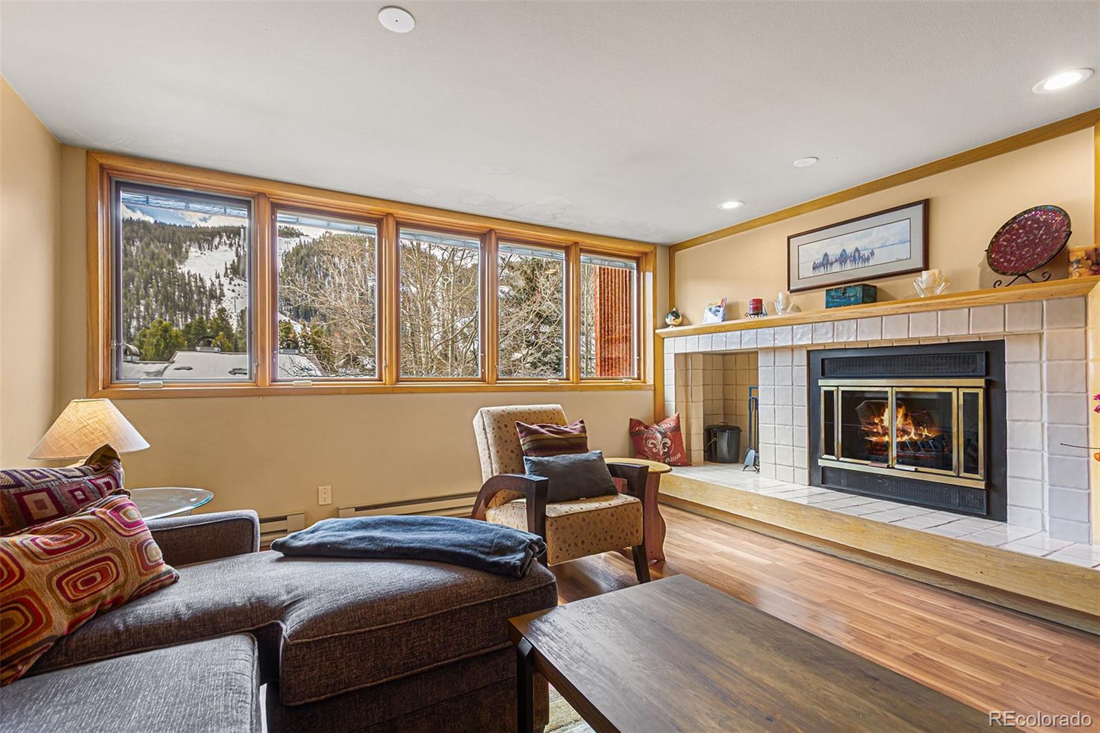 22864 Highway 6, Unit 107 Keystone, CO 80435 - Photo 9 of 20 a living room with furniture and a fireplace