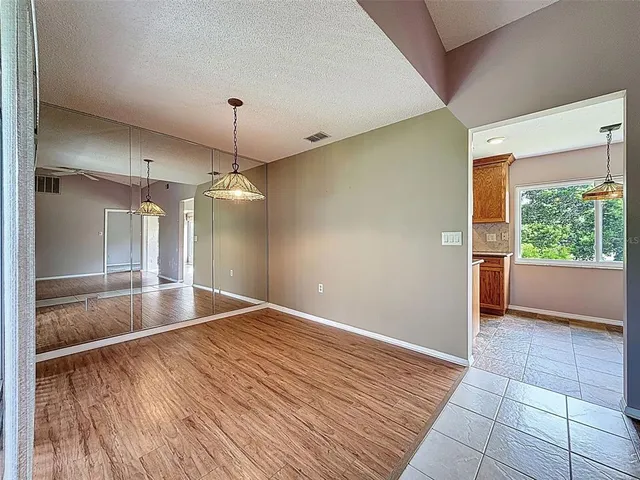 a stove top oven sitting inside of a kitchen