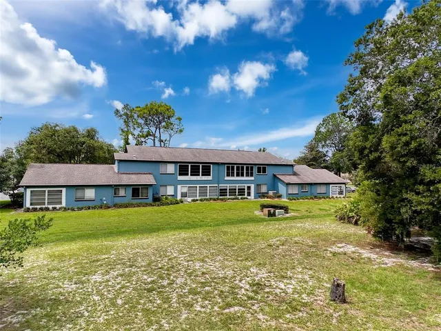 a view of a house with a big yard