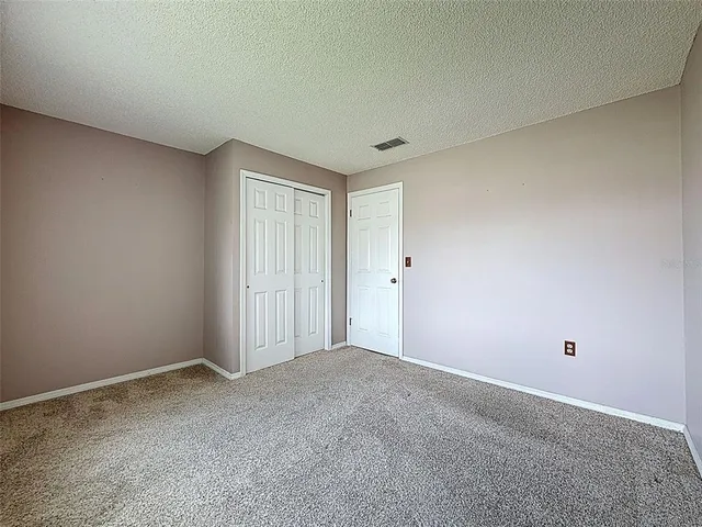 a bathroom with a toilet and a bathtub