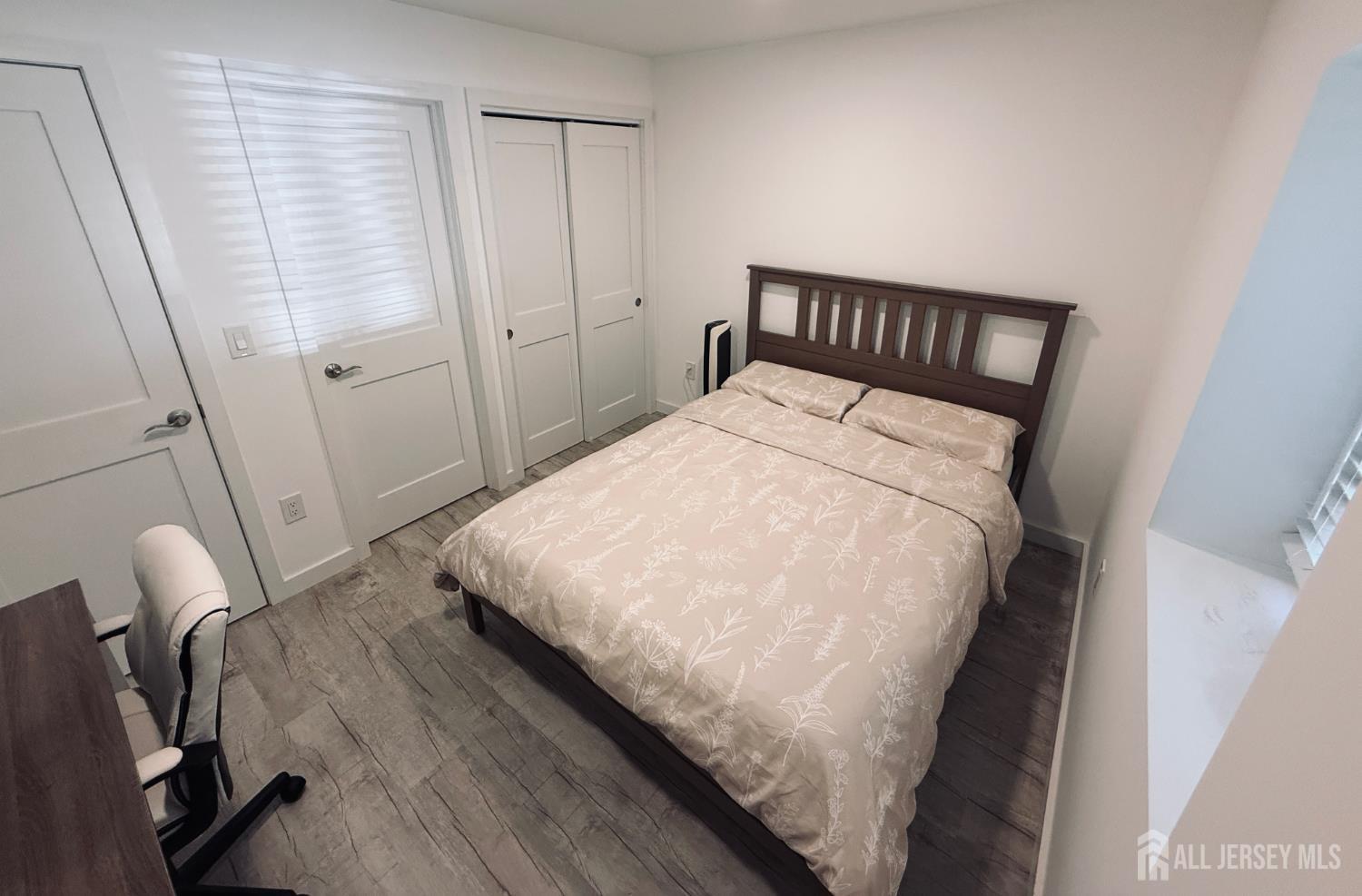 566 Ticetown Road Old Bridge, NJ 08857 - Photo 8 of 23 a bedroom with a bed and wooden floor