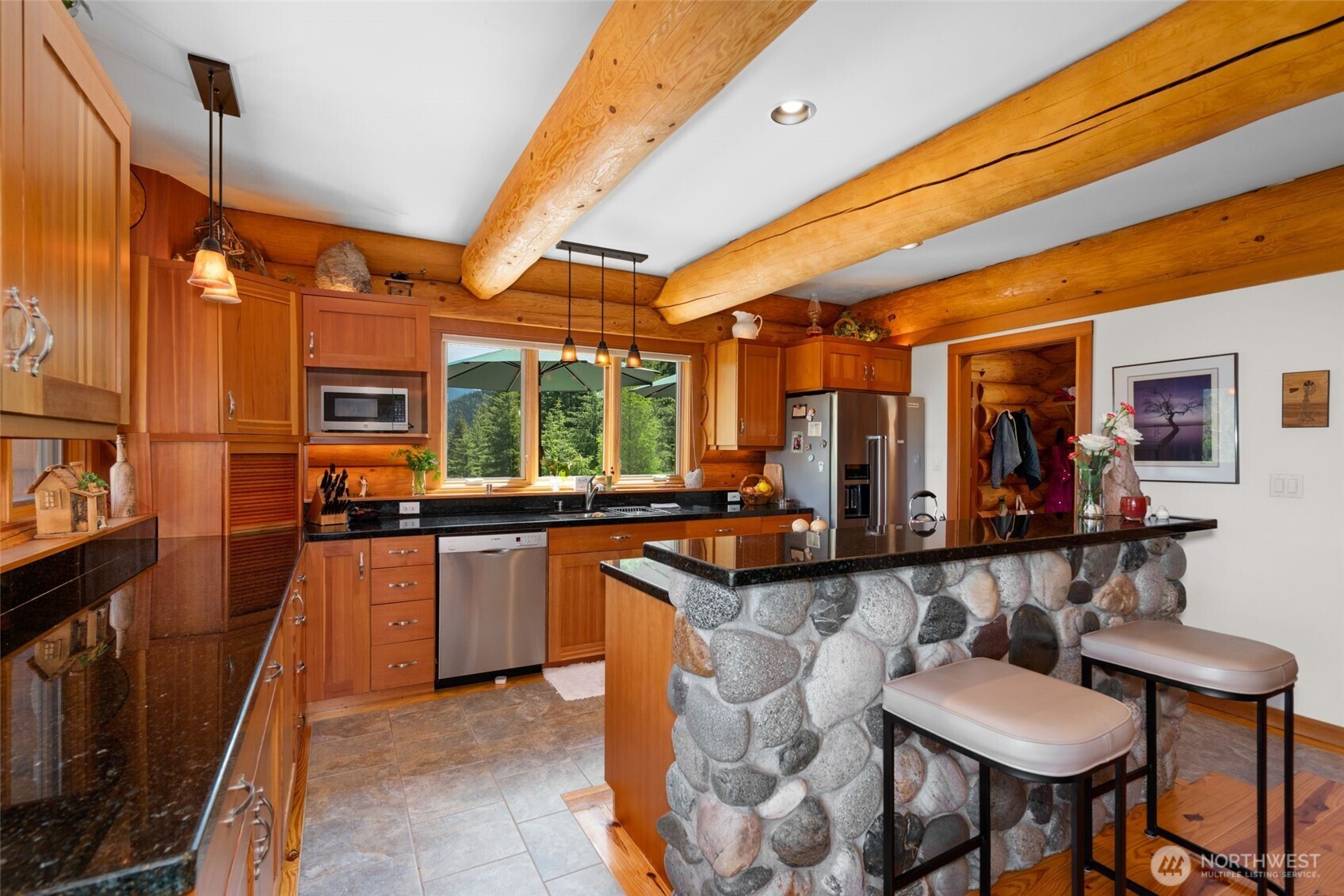 11411 Shugart Flats Road Leavenworth, WA 98826 - Photo 18 of 40 a large kitchen with a table and chairs