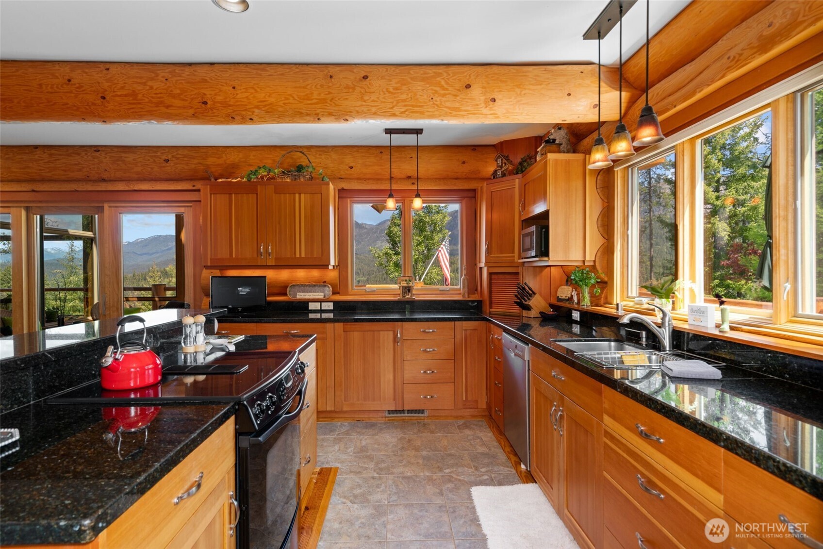 11411 Shugart Flats Road Leavenworth, WA 98826 - Photo 19 of 40 a kitchen with lots of counter top space and a sink