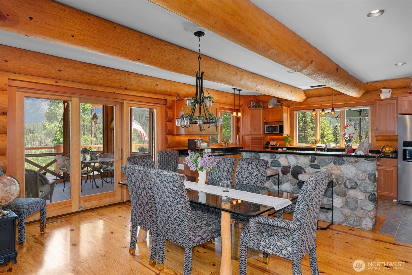11411 Shugart Flats Road Leavenworth, WA 98826 - Photo 22 of 40 a view of a dining area with furniture window and wooden floor