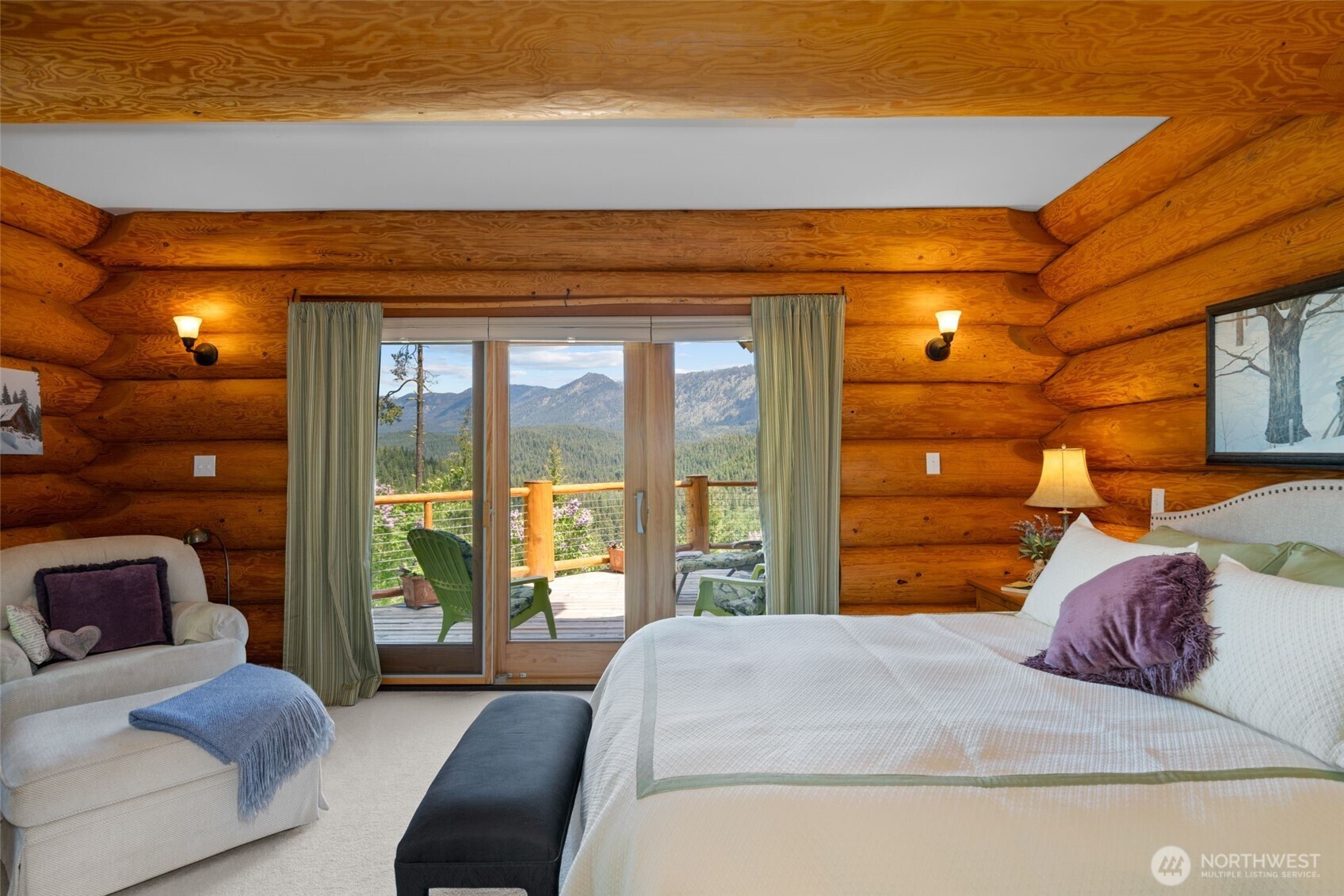 11411 Shugart Flats Road Leavenworth, WA 98826 - Photo 23 of 40 a bedroom with a bed and a lamp next to a window