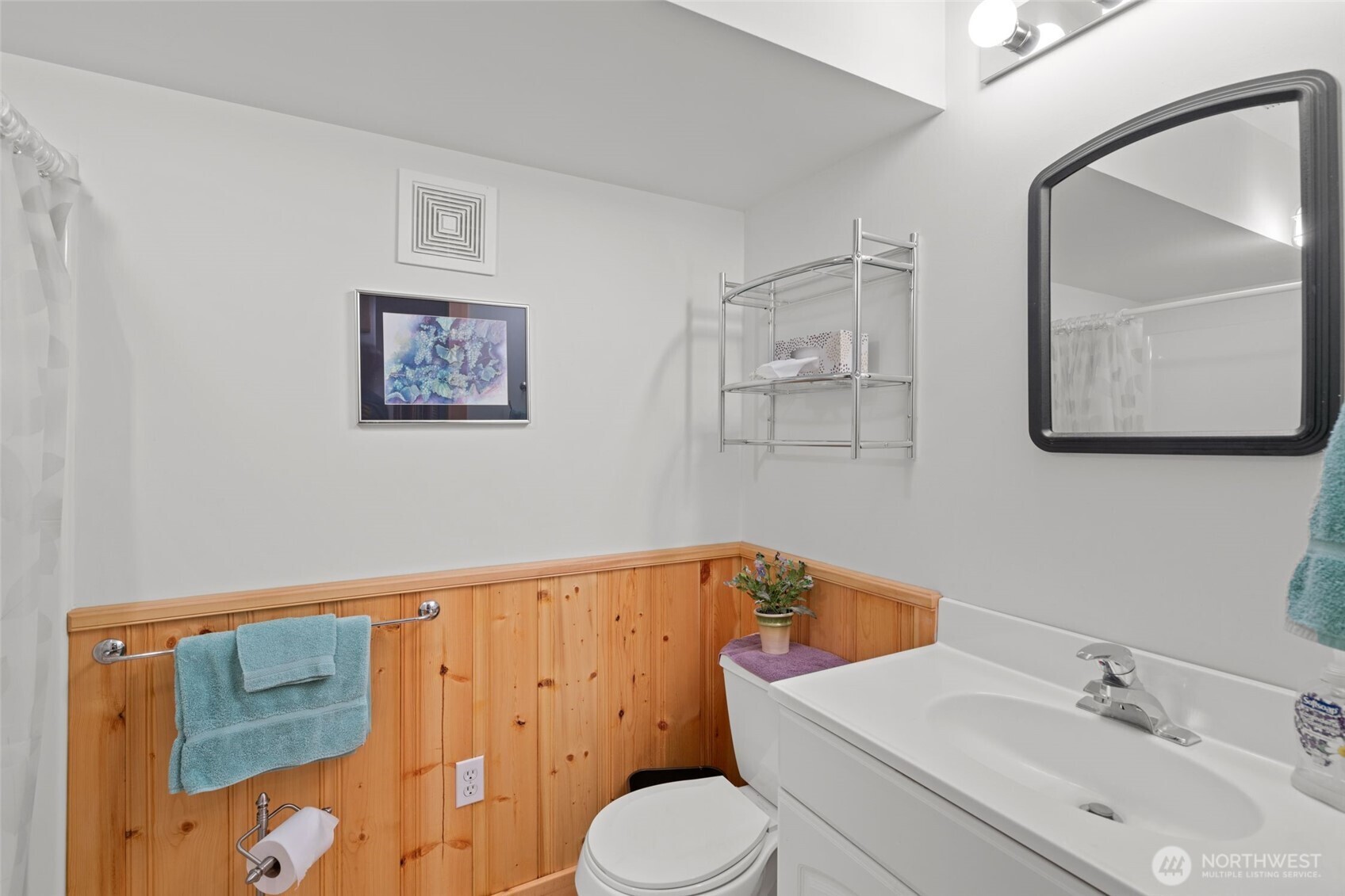 11411 Shugart Flats Road Leavenworth, WA 98826 - Photo 38 of 40 a bathroom with a sink mirror vanity and toilet
