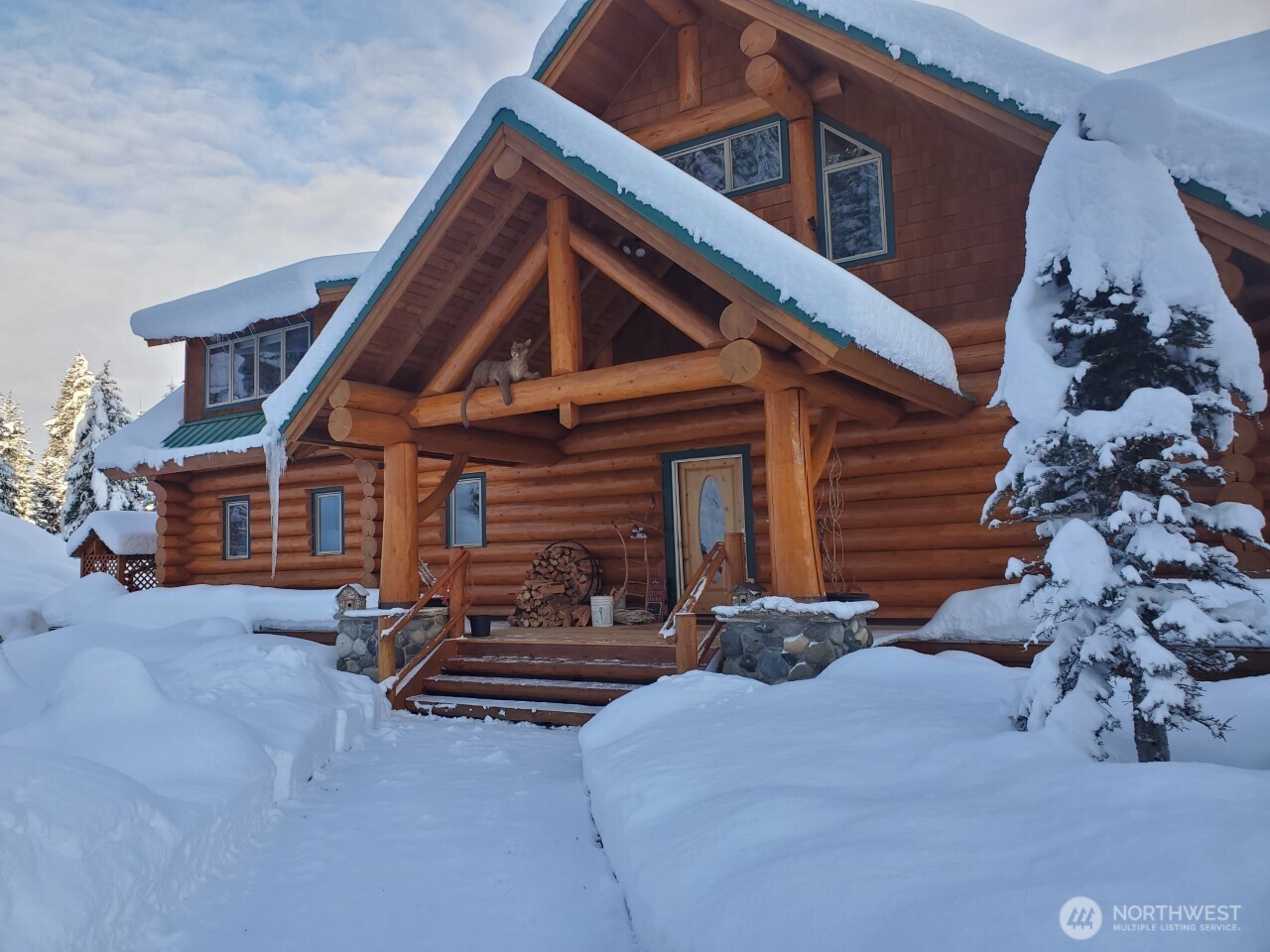11411 Shugart Flats Road Leavenworth, WA 98826 - Photo 39 of 40 a backyard of a house with barbeque oven and brick wall