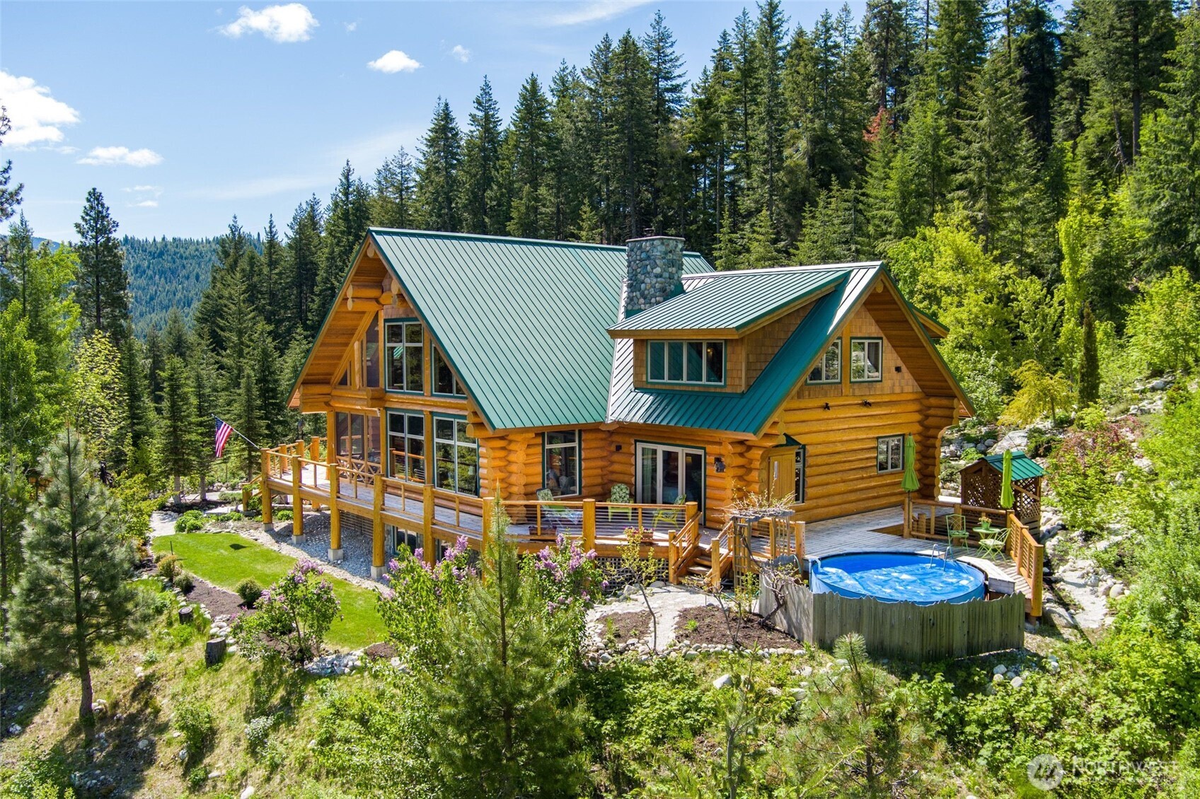 11411 Shugart Flats Road Leavenworth, WA 98826 - Photo 4 of 40 a aerial view of a house with swimming pool and garden view