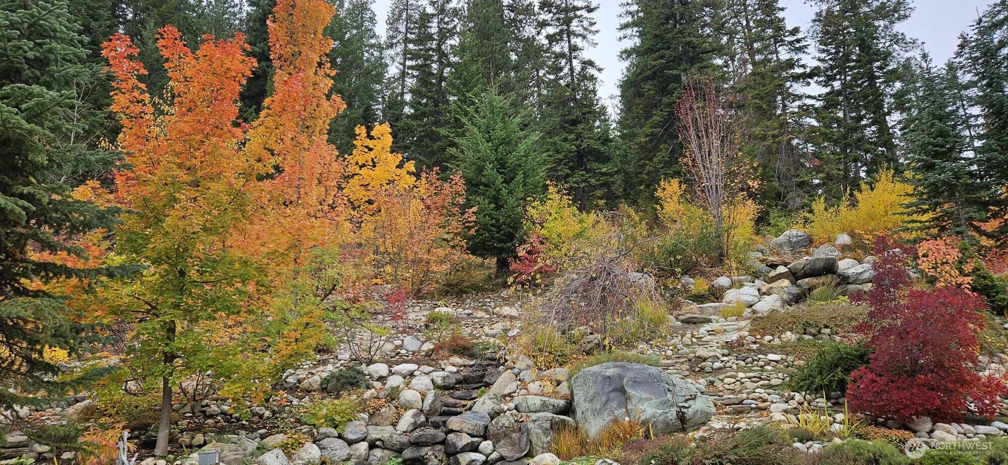 11411 Shugart Flats Road Leavenworth, WA 98826 - Photo 7 of 40 a backyard of a house with a yard and outdoor seating