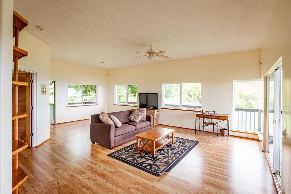 750 Kapia Road, Unit 36 Hana, HI 96713 - Photo 14 of 29 a living room with furniture and a wooden floor