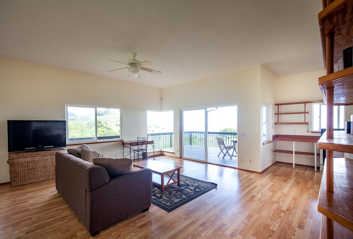 750 Kapia Road, Unit 36 Hana, HI 96713 - Photo 15 of 29 a living room with furniture and a flat screen tv