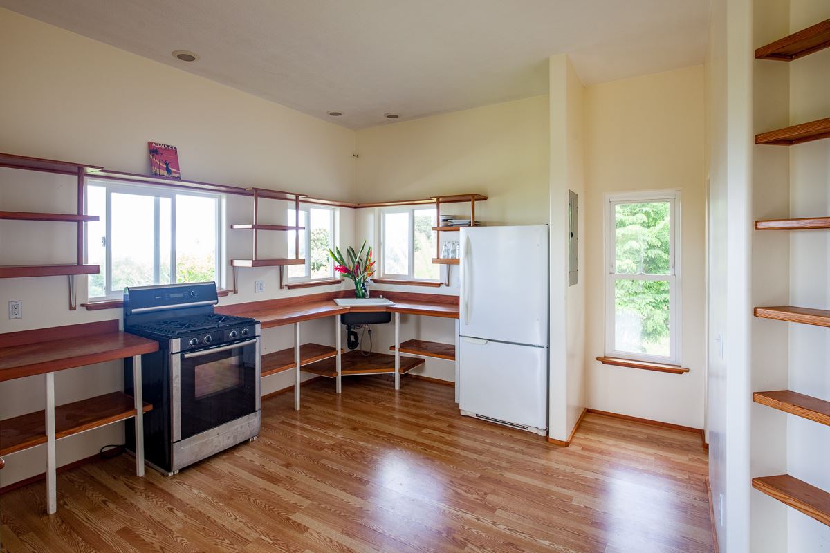 750 Kapia Road, Unit 36 Hana, HI 96713 - Photo 18 of 29 a dining room with furniture and wooden floor