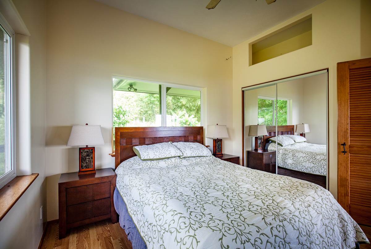 750 Kapia Road, Unit 36 Hana, HI 96713 - Photo 20 of 29 a bedroom with a large bed and a large window