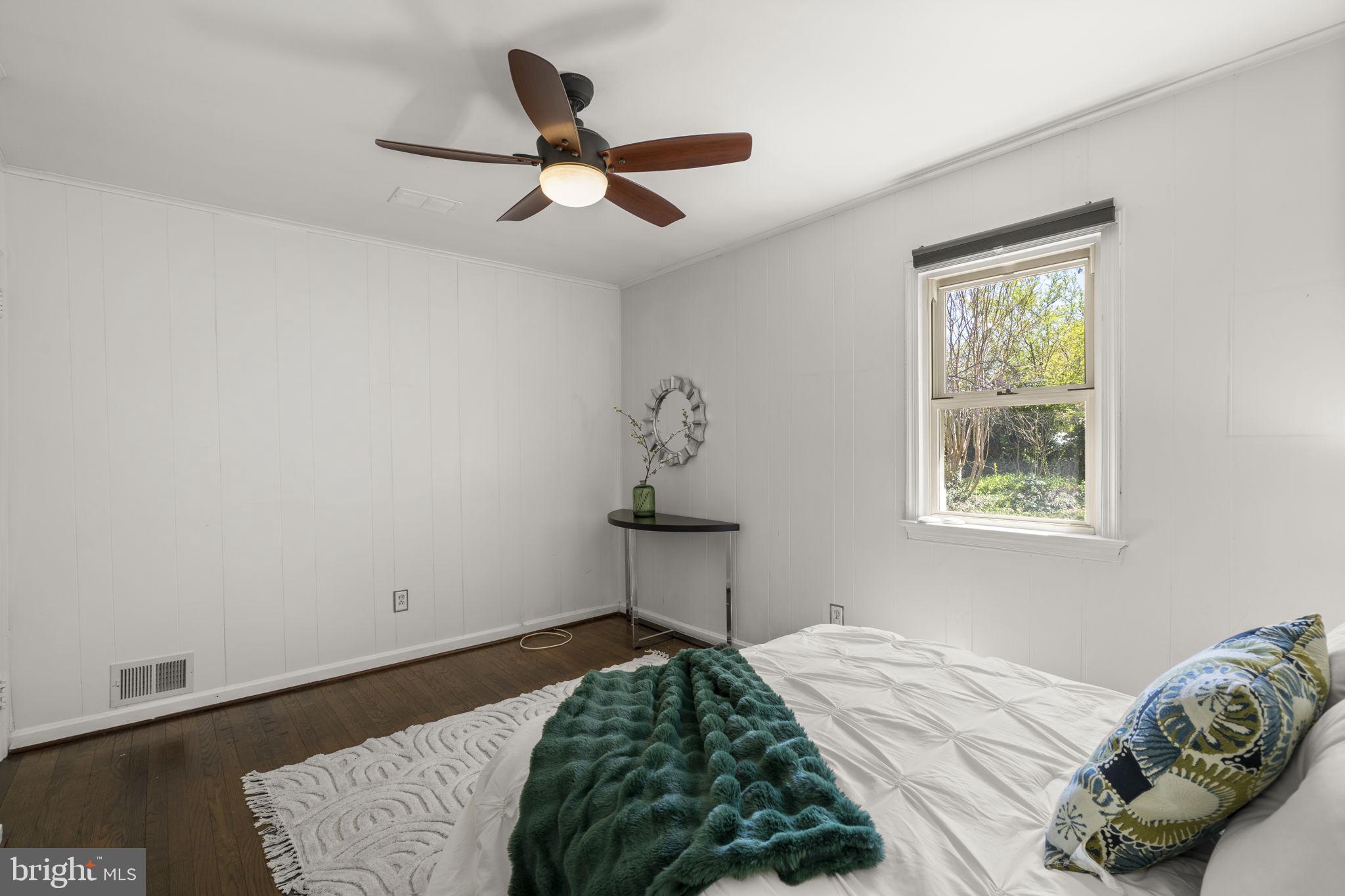 7005 Grove Road Alexandria, VA 22306 - Photo 30 of 52 a bedroom with a bed and a window