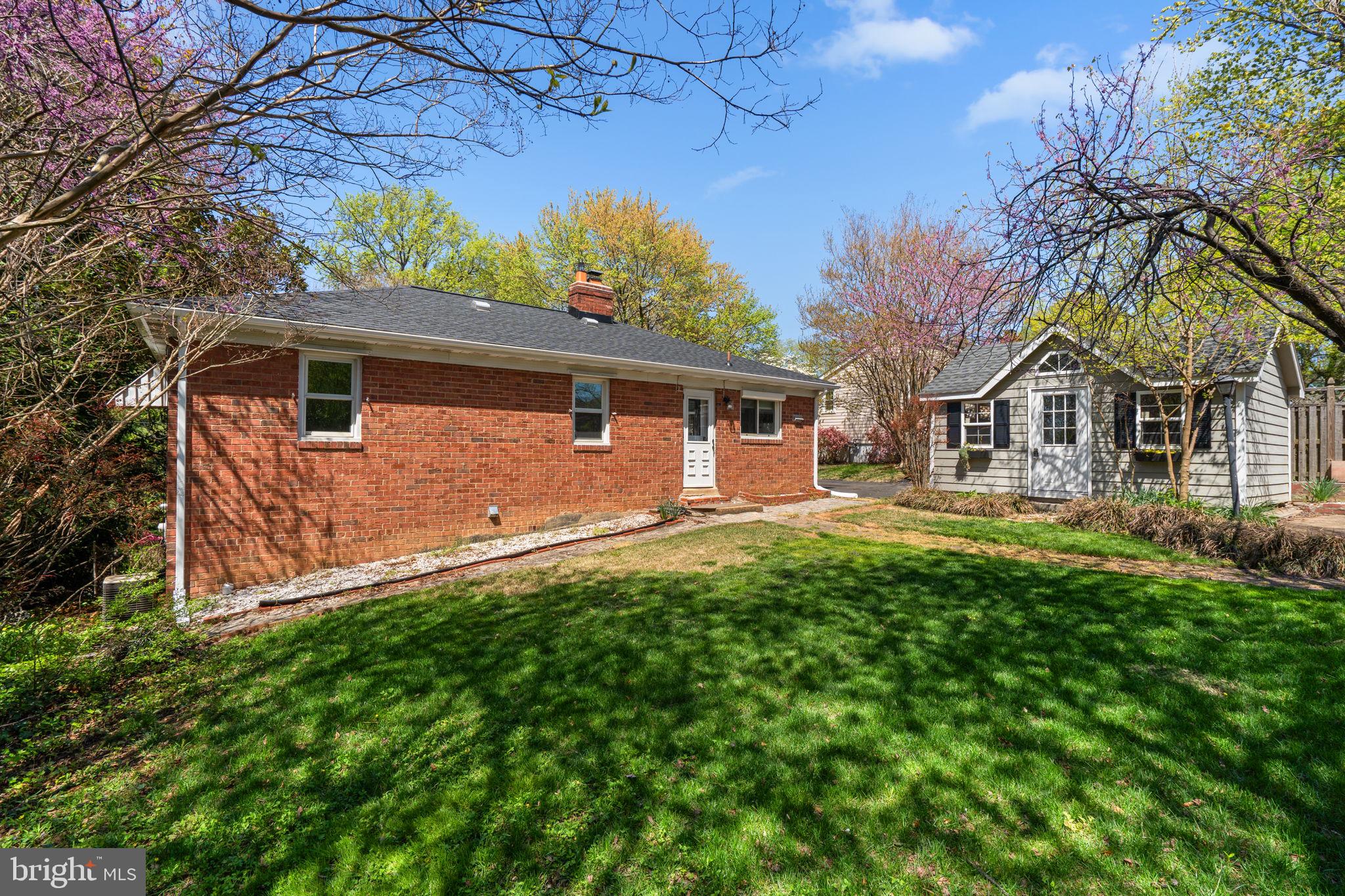 7005 Grove Road Alexandria, VA 22306 - Photo 39 of 52 a front view of a house with garden