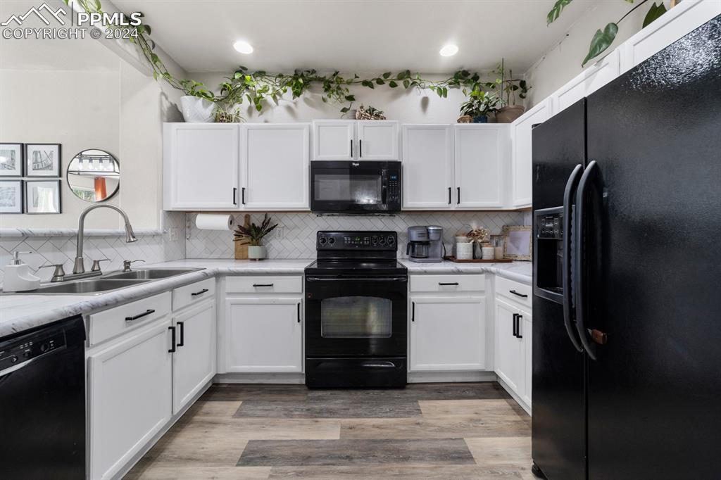 7375 Sandy Springs Point Fountain, CO 80817 - Photo 18 of 31 a kitchen with a sink stove and refrigerator