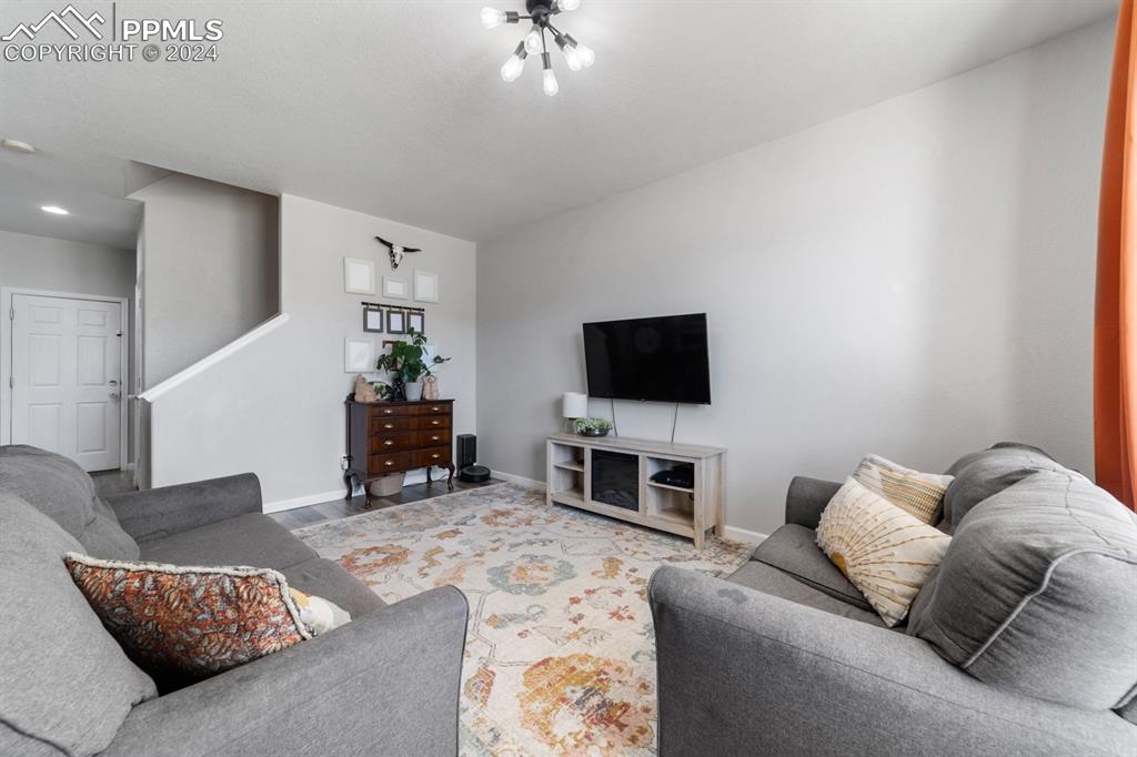 7375 Sandy Springs Point Fountain, CO 80817 - Photo 23 of 31 a living room with furniture and a flat screen tv