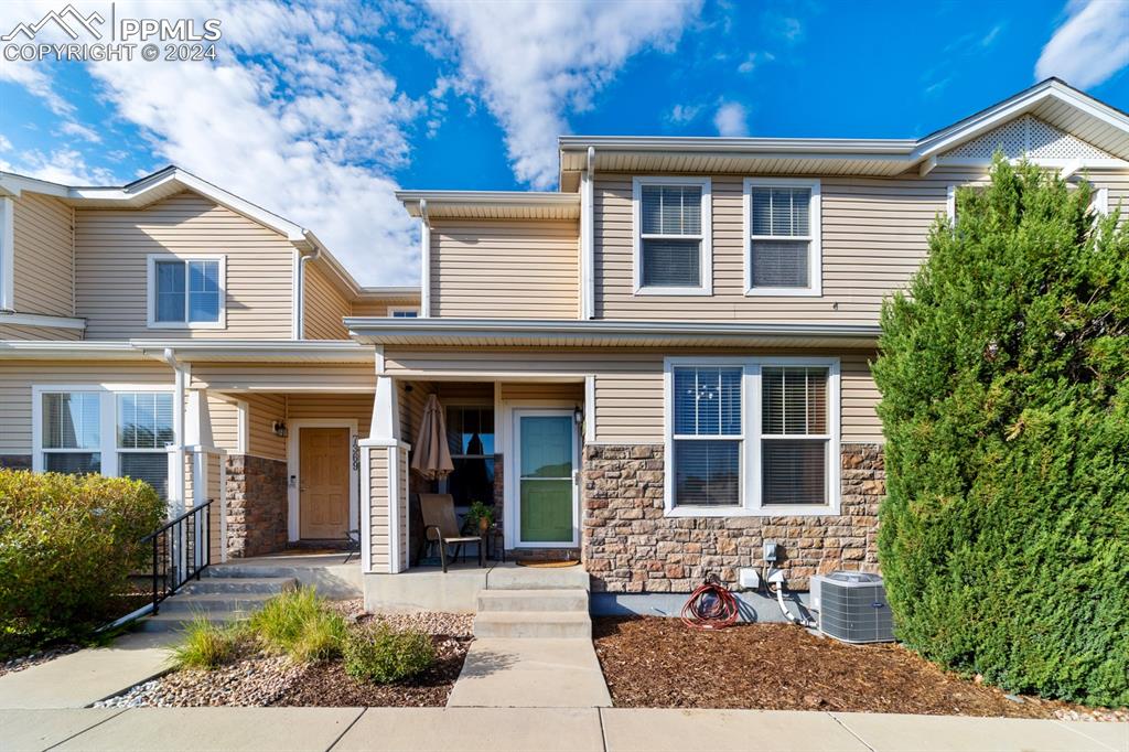 7375 Sandy Springs Point Fountain, CO 80817 - Photo 25 of 31 a front view of a house with garden