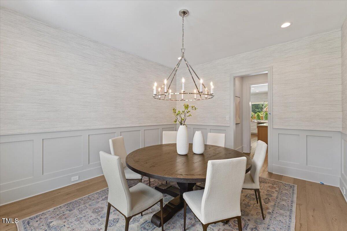 6844 Greystone Drive Raleigh, NC 27615 - Photo 11 of 83 a dining room with furniture and chandelier