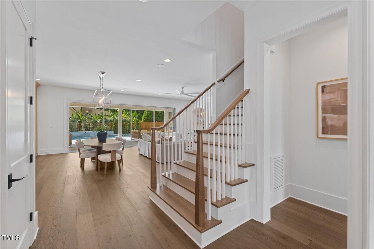 6844 Greystone Drive Raleigh, NC 27615 - Photo 12 of 83 a view of entryway with wooden floor and a window