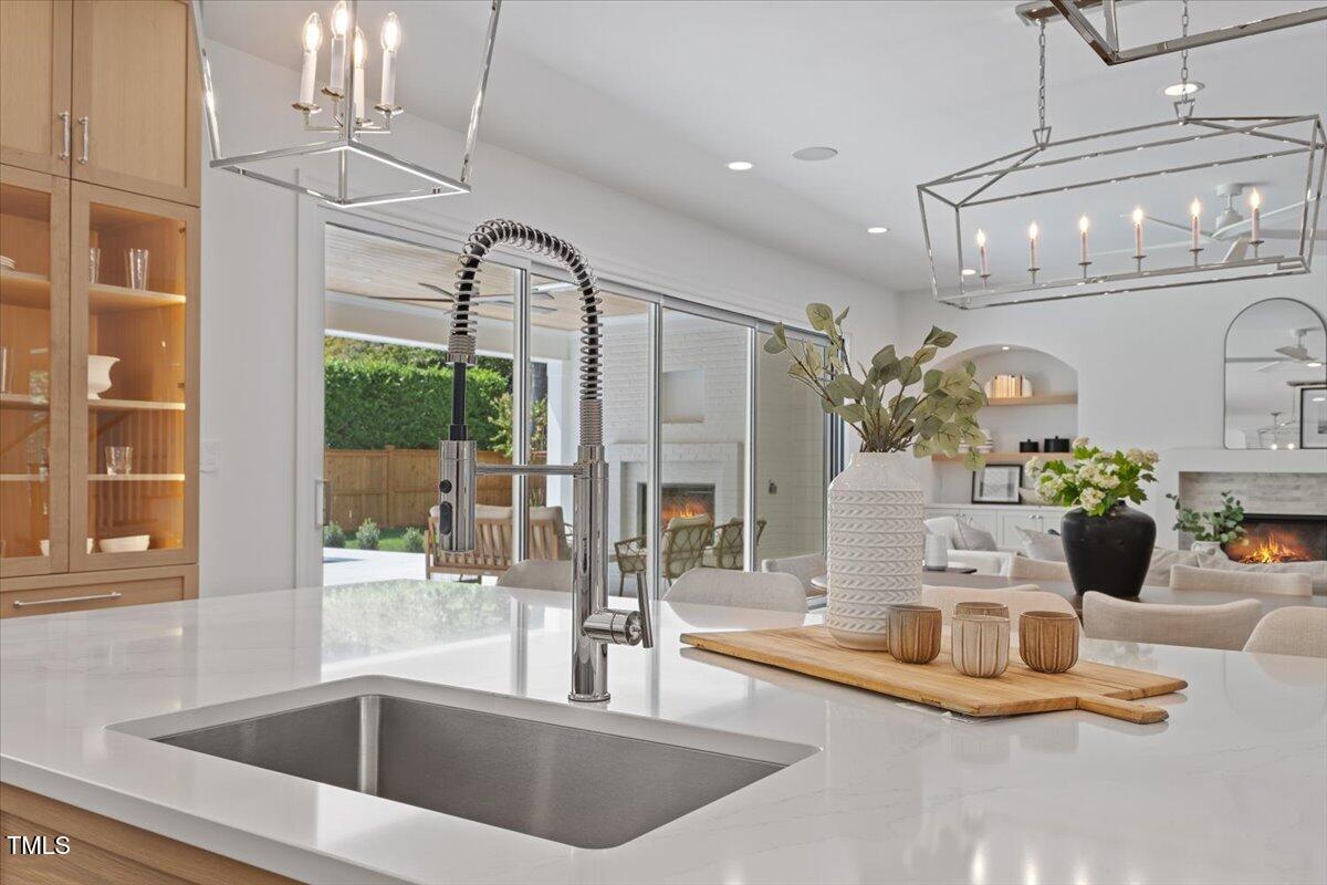 6844 Greystone Drive Raleigh, NC 27615 - Photo 18 of 83 a view of kitchen with sink and living room