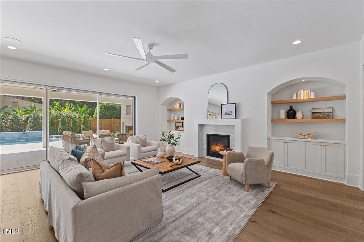 6844 Greystone Drive Raleigh, NC 27615 - Photo 19 of 83 a living room with furniture fireplace and window