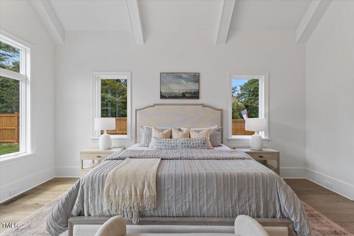 6844 Greystone Drive Raleigh, NC 27615 - Photo 32 of 83 a bedroom with a bed and a window