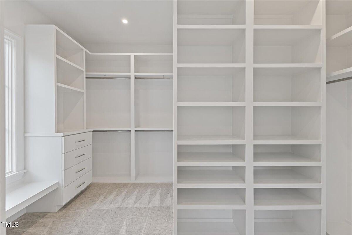 6844 Greystone Drive Raleigh, NC 27615 - Photo 39 of 83 a view of an empty walk in closet