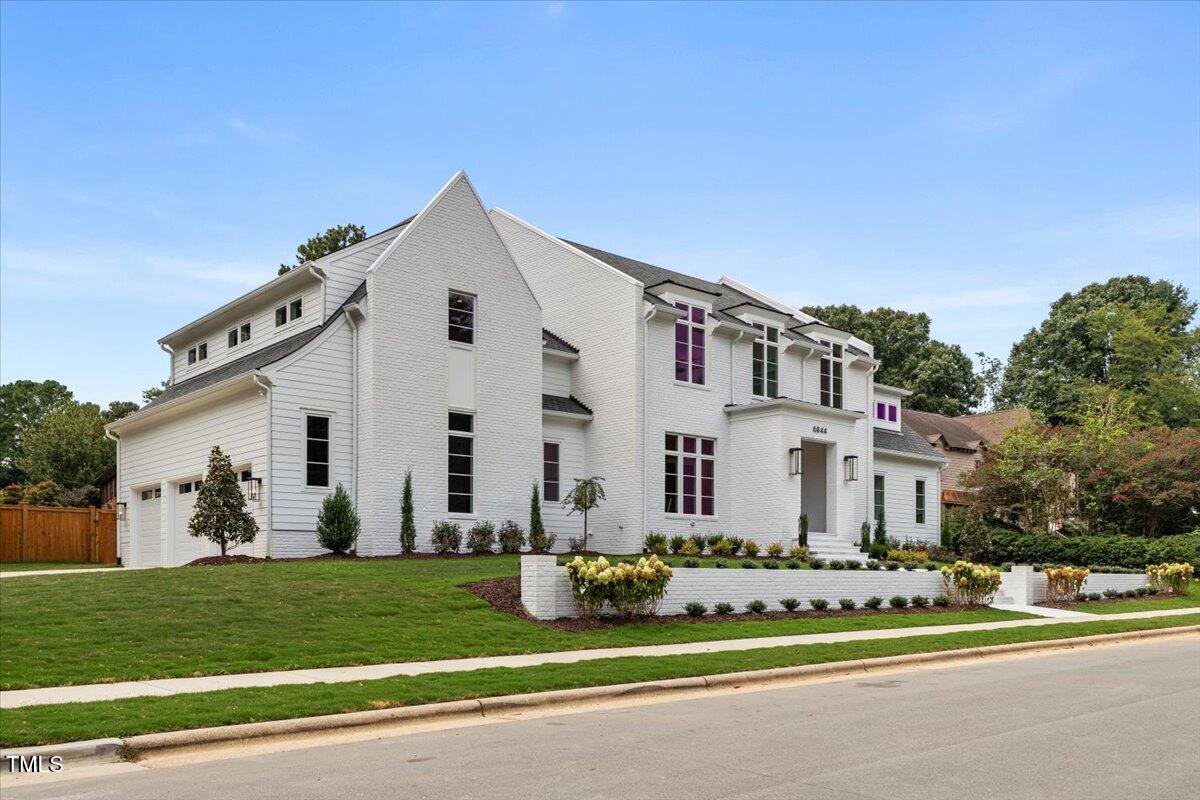 6844 Greystone Drive Raleigh, NC 27615 - Photo 4 of 83 a front view of a house with a yard