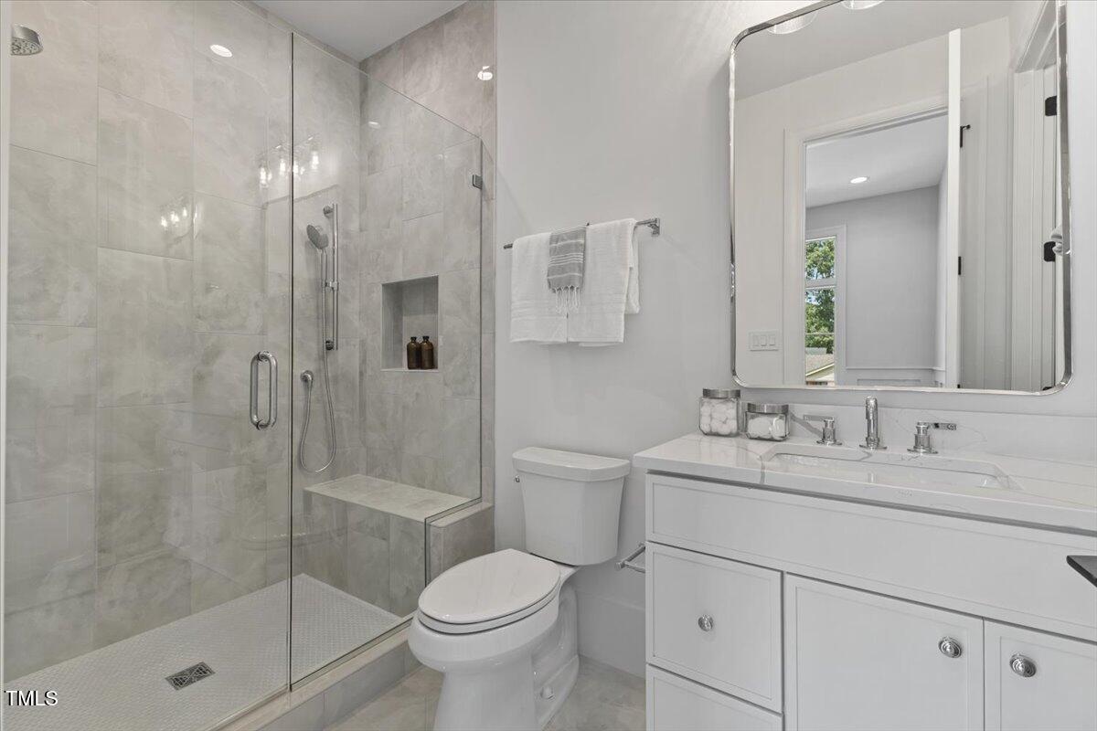 6844 Greystone Drive Raleigh, NC 27615 - Photo 44 of 83 a bathroom with a sink a toilet and shower